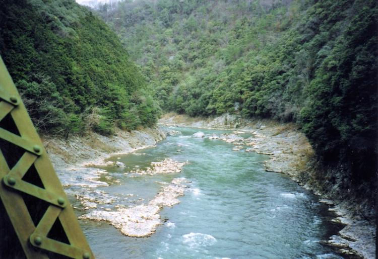 View of Hozugawa river from the window of Sagano Scenic Train