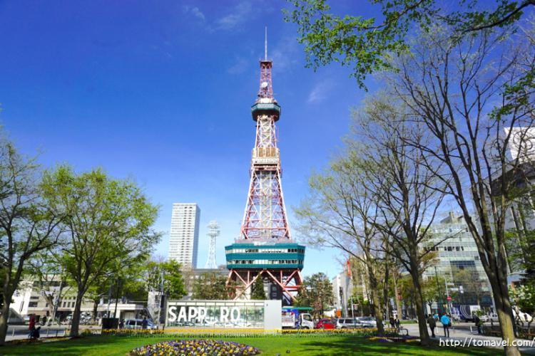 Sapporo TV Tower and blue sky in daytime seen from Odori Park plaza